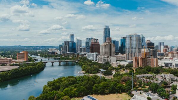 Austin skyline with tall buildings and winding river.