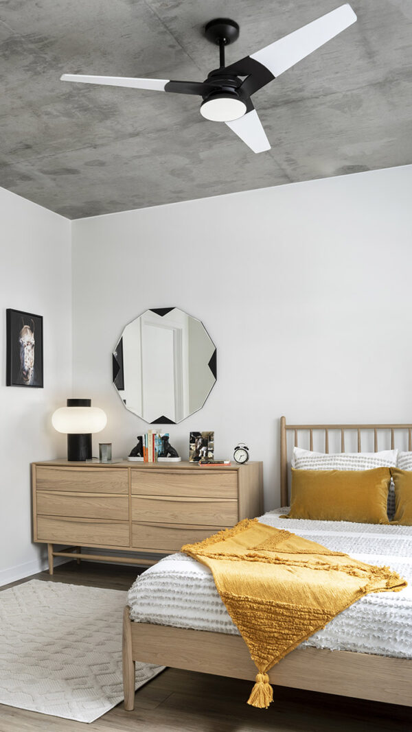 Spacious apartment bedroom with wood floors.