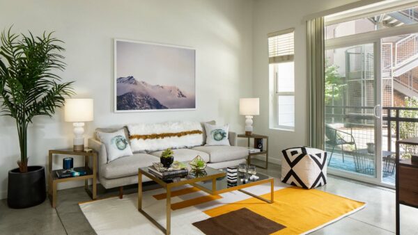 Apartment Living Room with polished concrete floors and patio.