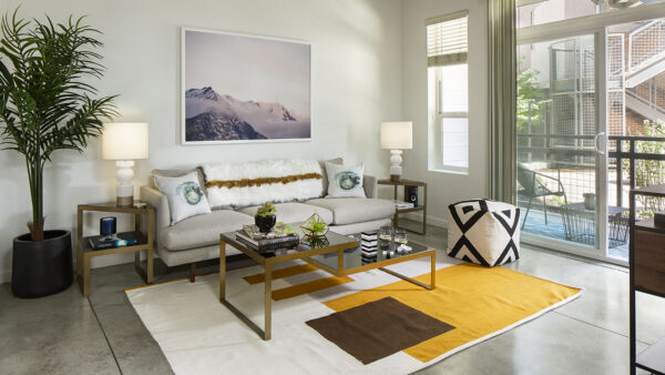 Apartment Living Room with polished concrete floors and patio.