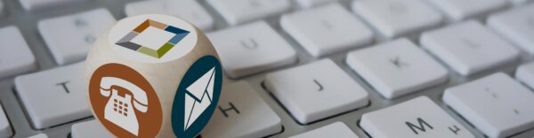 Keyboard with dice containing Griffis Residential contact icons.