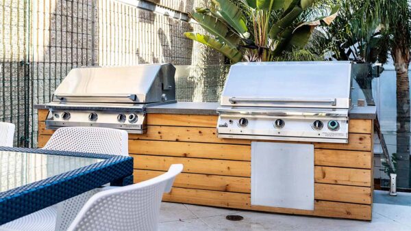 Apartment community outdoor grilling station at Griffis Pine Ave in Long Beach, California.