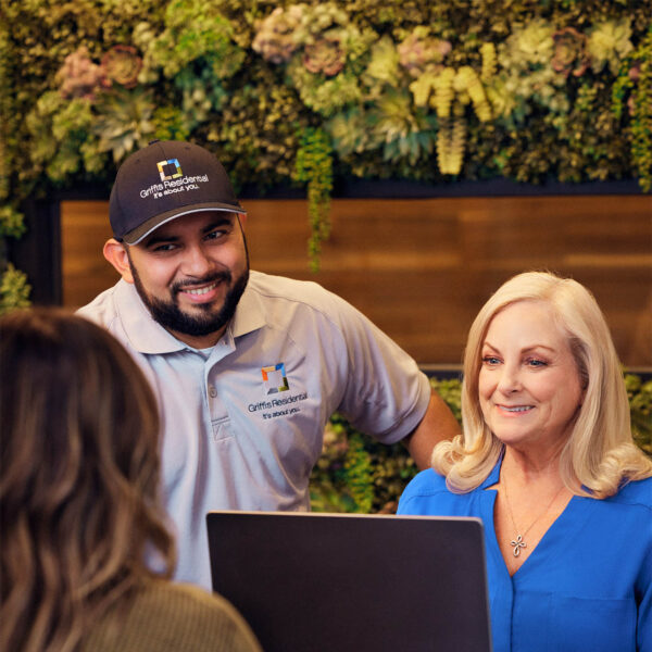 Griffis employees collaborating in property office.