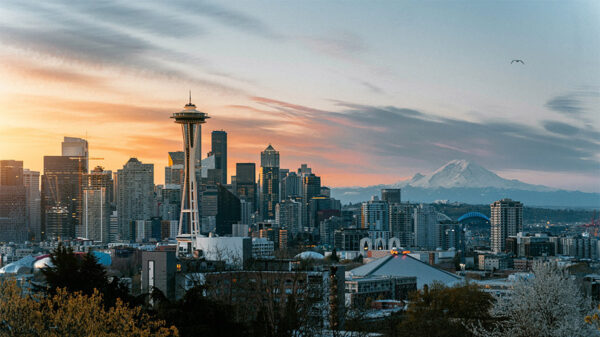 Seattle skyline with Space Needle and Mount Rainier in the background.