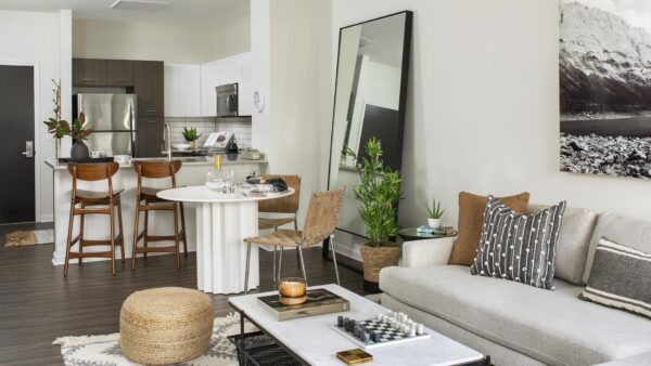 Apartment Living Room, dining area and kitchen with wood floors.
