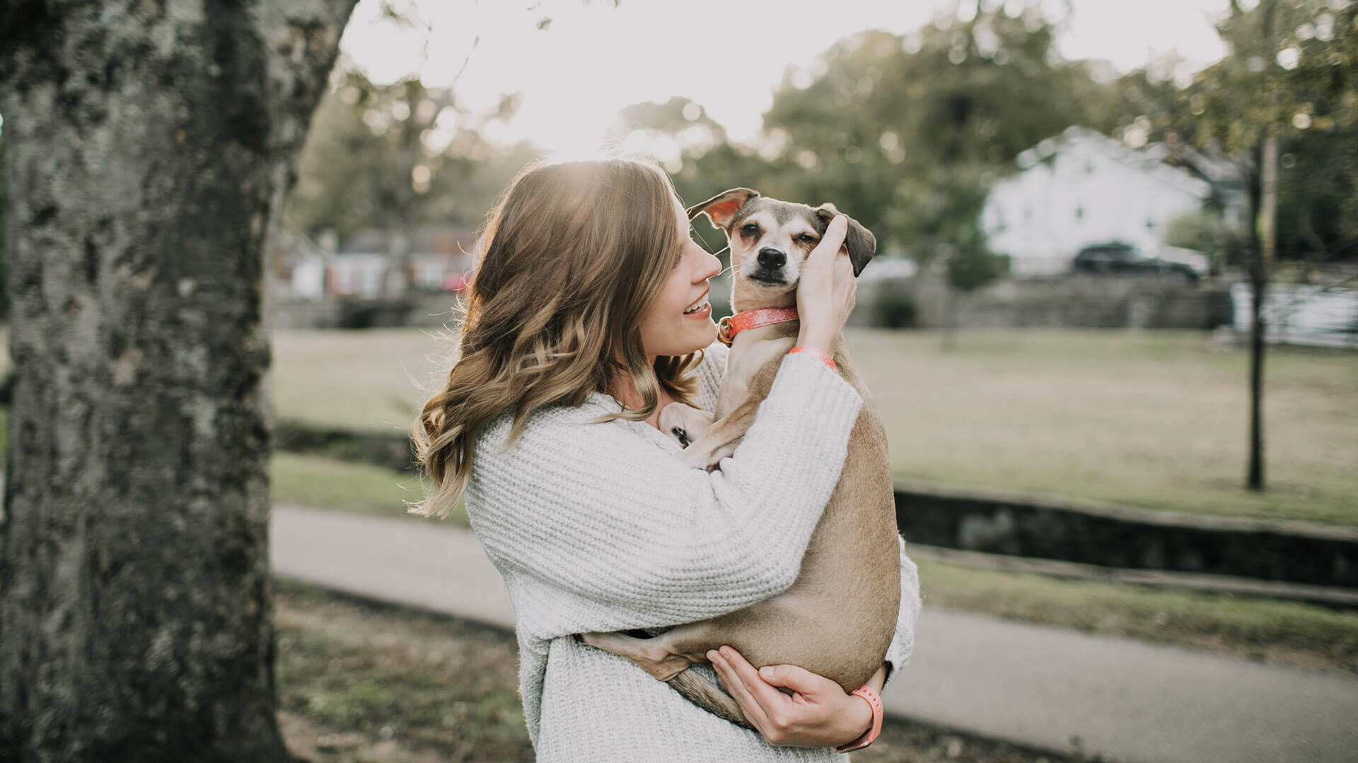 Woman holding pet dog