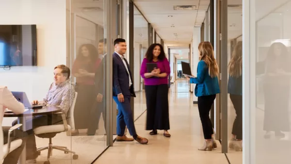 Griffis Residential team members working together in corporate office.