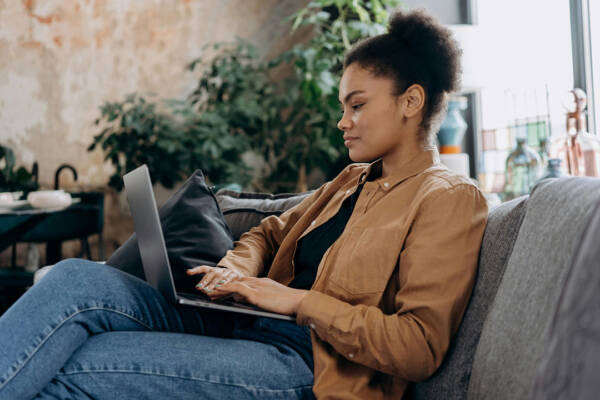 Woman on computer budgeting for her apartment