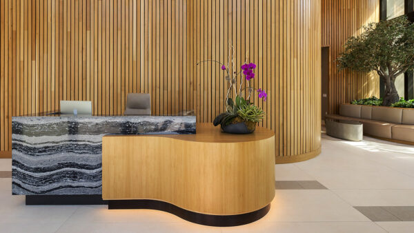 Griffis West Palm apartments leasing center with elegant stone desk.