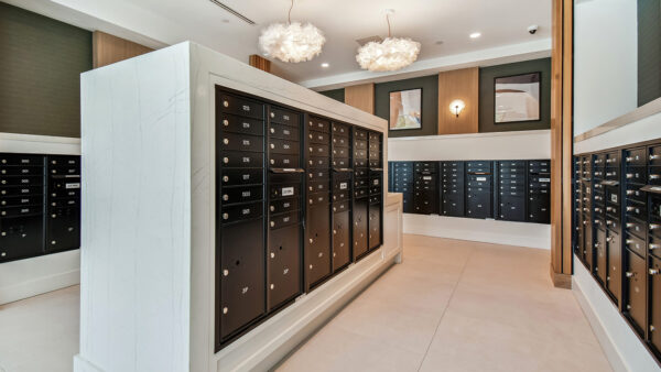 Griffis West Palm apartments mail room with mailboxes and parcel lockers.