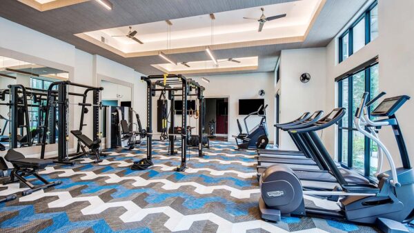 Griffis Frisco fitness center with cardio machines and weight equipment.