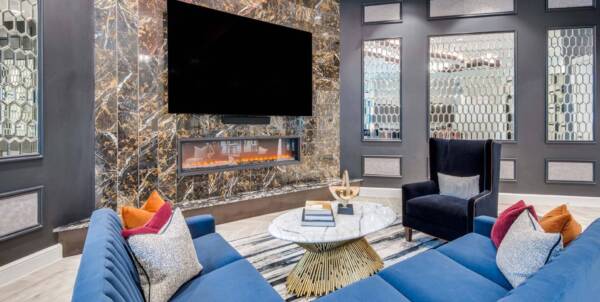 Griffis Frisco resident lounge with fireplace.