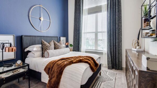 Griffis Frisco apartment bedroom with plush carpet.