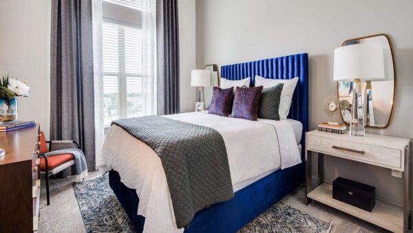 Griffis Frisco apartment bedroom with plush carpet.