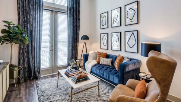 Griffis Frisco apartment living room with wood style floor.