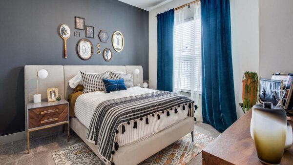 Griffis Frisco apartment bedroom with plush carpet.