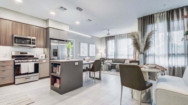 Griffis Platinum Triangle apartment kitchen with stainless steel appliances.