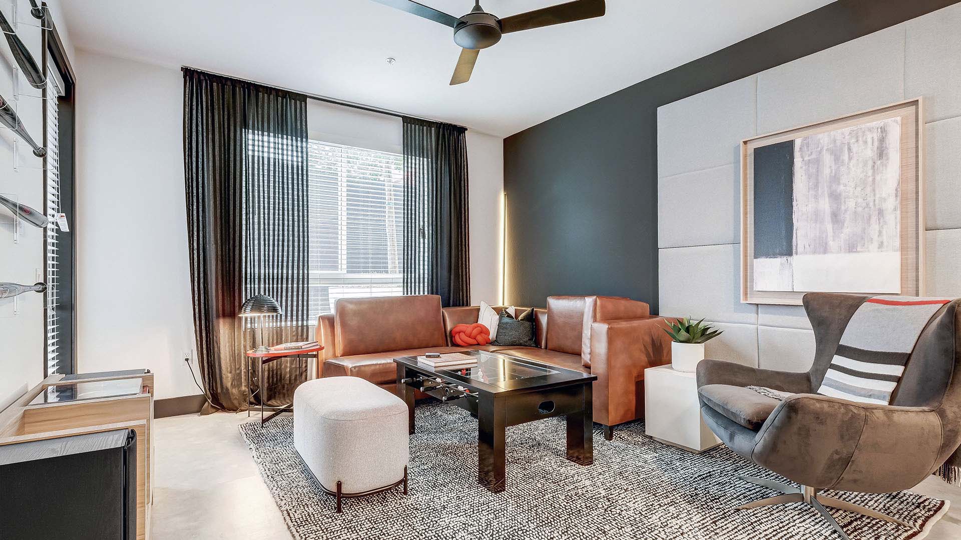 Griffis Platinum Triangle apartment living room with wood style floor.