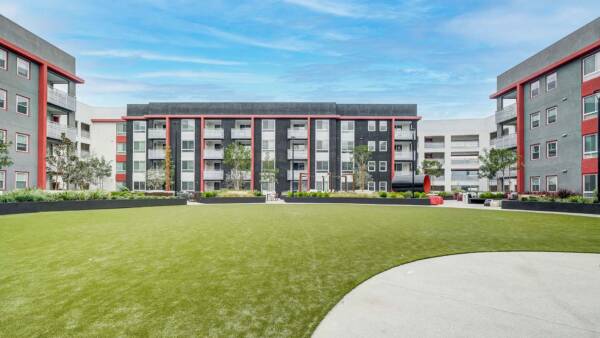 Griffis Platinum Triangle outdoor park with grassy lawn.