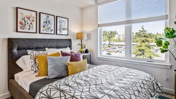 Griffis Shoreline apartment bedroom with large window.
