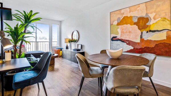 Griffis Shoreline apartment dining area with wood style floor.