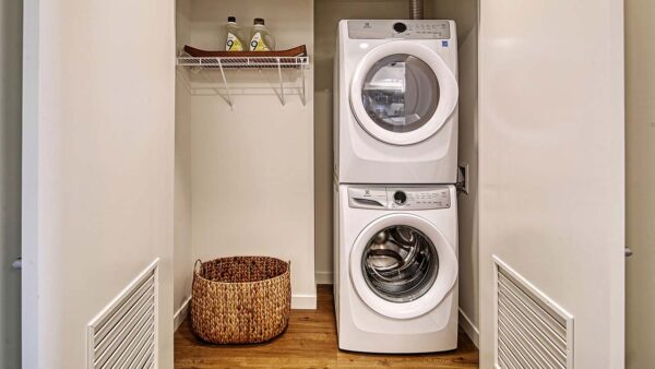 Griffis Shoreline apartment laundry closet with stacked washer dryer.