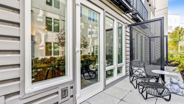 Griffis Shoreline apartment balcony with lounge chair.