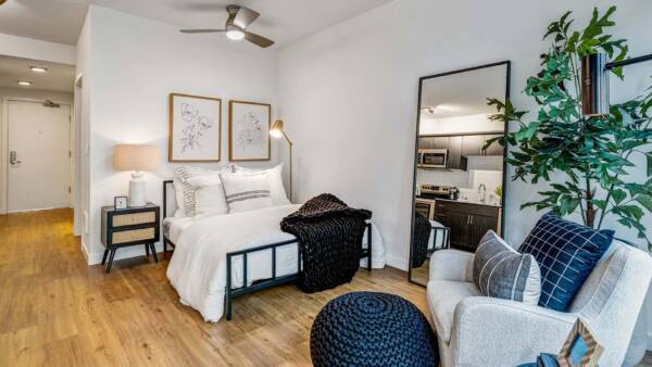 Griffis Shoreline studio apartment living area with wood style floor.