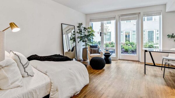 Griffis Shoreline studio living area with wood style flooring.