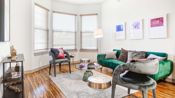 Griffis Uptown apartment living room with wood style floor.