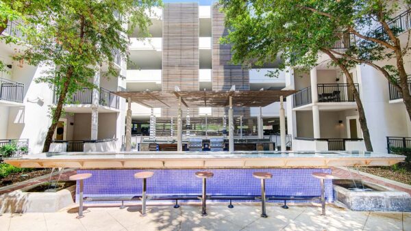 Griffis Uptown outdoor lounge with BBQ grills.