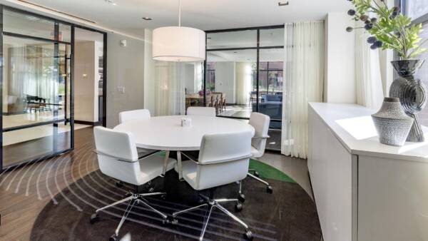 Griffis Edgemoor conference room with a round white table and modern chairs.