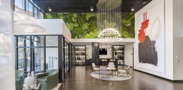 Griffis Edgemoor leasing center with a living green wall and lounge seating.