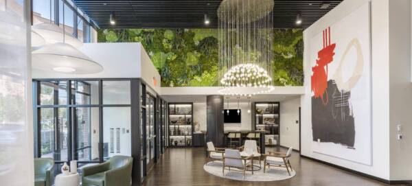Griffis Edgemoor leasing center with a living green wall and lounge seating.