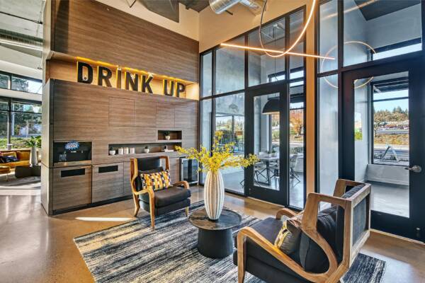 Griffis Shoreline resident coffee bar with lounge seating and large windows.