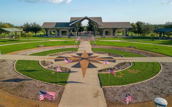 Frisco Commons Park with American flags near Griffis Frisco.