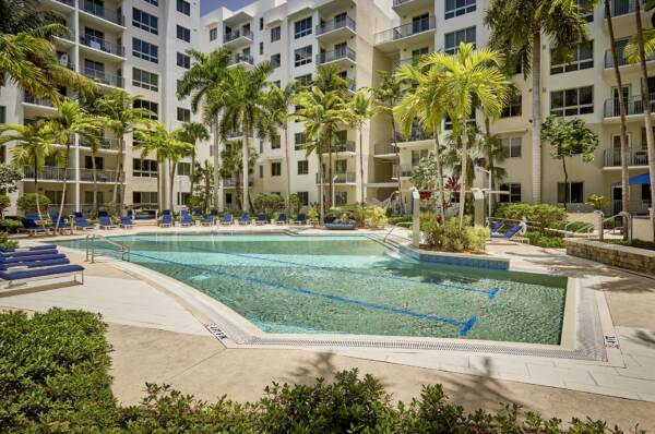 Pool deck with lounge chairs at Griffis North Olive.