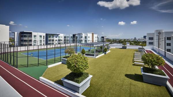 Rooftop deck with tennis court at Griffis North Olive.