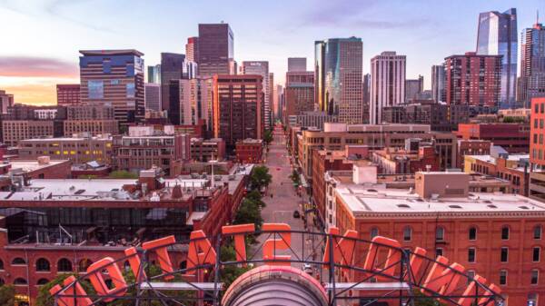 Aerial view of the Union Station sign and downtown Denver skyline at sunset