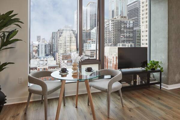 Griffis Seattle Waterfront apartment dining nook beside floor-to-ceiling windows with downtown views