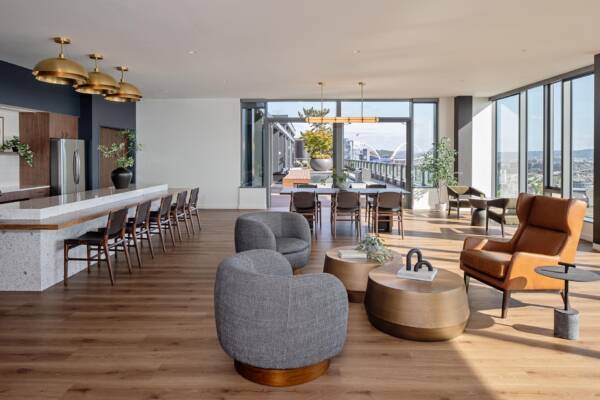 Griffis Seattle Waterfront Sky Lounge with bar seating, lounge chairs, and Elliott Bay views