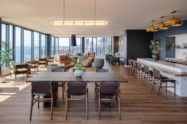 Griffis Seattle Waterfront Sky Lounge with communal dining tables and panoramic windows