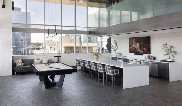 Griffis Platform Union Station resident lounge with billiards table and kitchen with bar seating