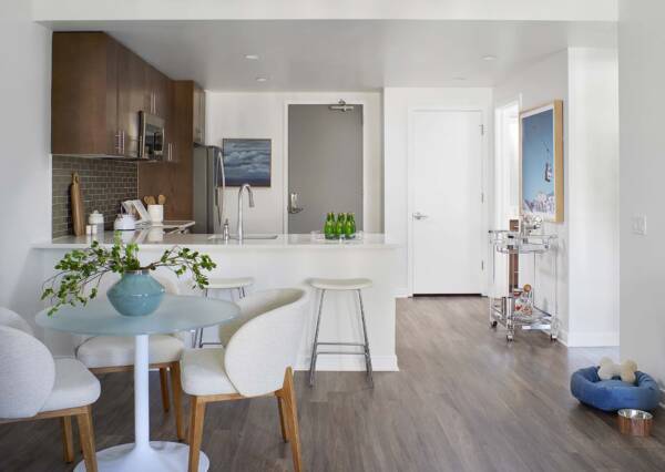 Griffis Platform Union Station apartment kitchen and dining area with breakfast bar and wood-style flooring