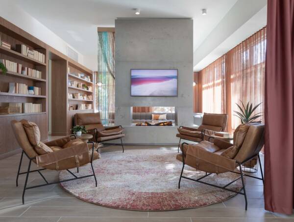 Griffis at The Domain community resident lounge with fireplace.