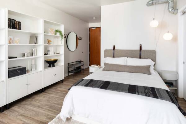 Griffis East Village apartment bedroom with wood style floor in San Diego, CA.