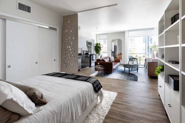 Griffis East Village studio apartment bedroom and closet with wood style floor in San Diego, CA.