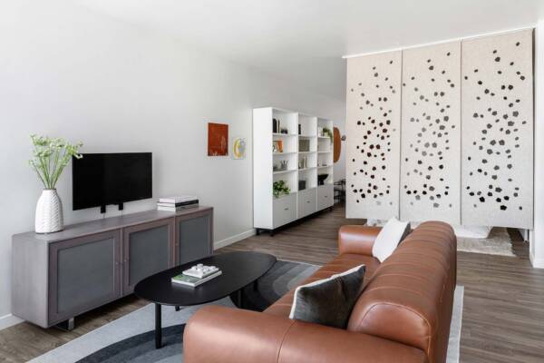 Griffis East Village apartment living room with wood style floor in San Diego, CA.