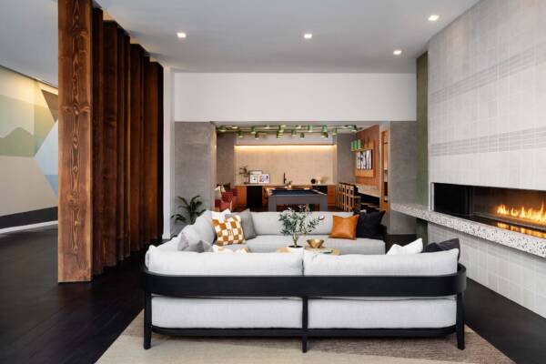 Griffis East Village apartment community resident lounge with fireplace in San Diego, CA..
