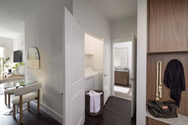 Griffis Oak Lawn apartment hallway with wood style floor.